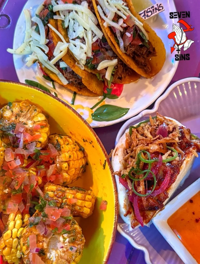 A colourful spread of tacos and side dishes