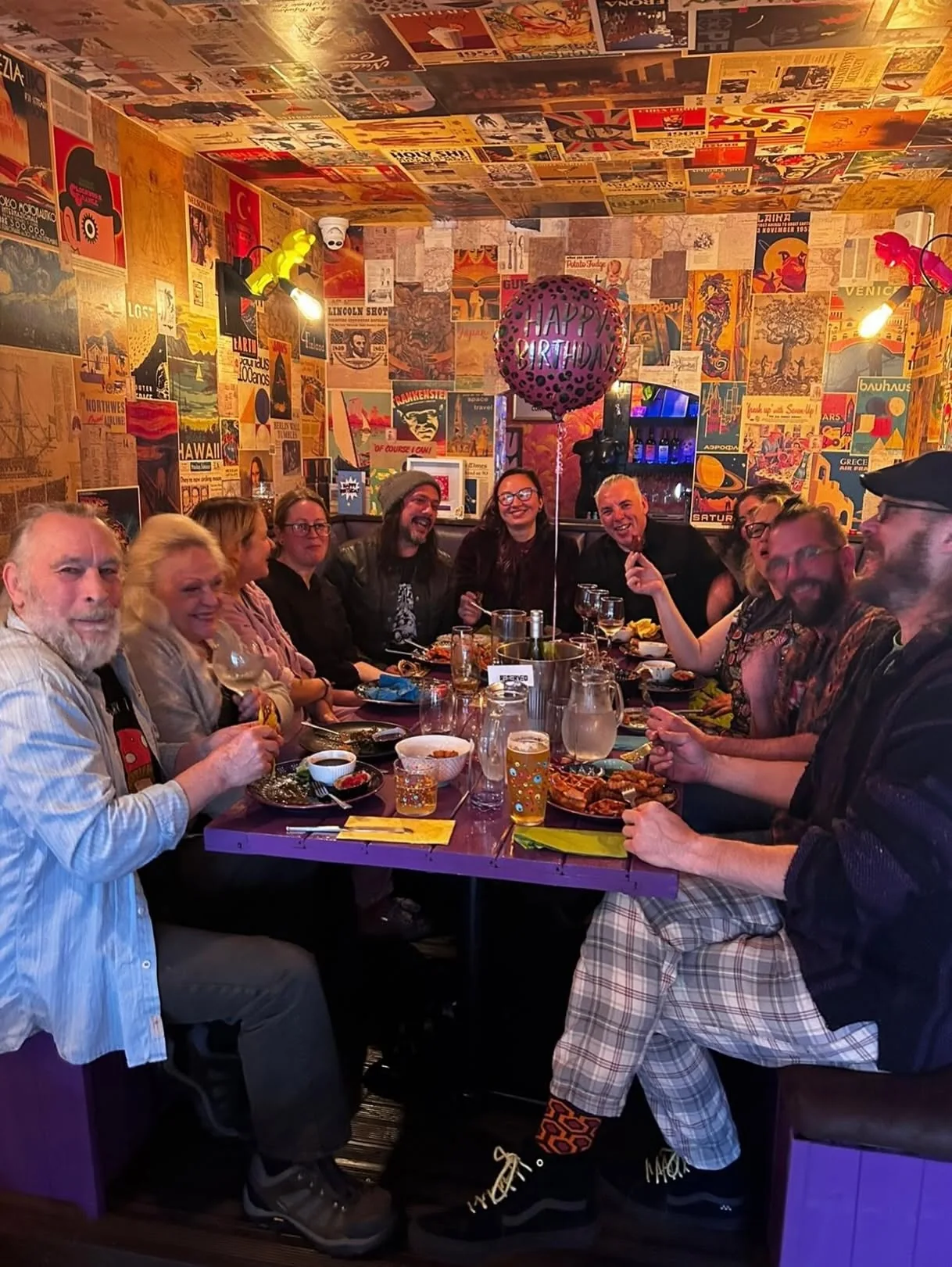 A group dining inside the colourful Seven Sins restaurant